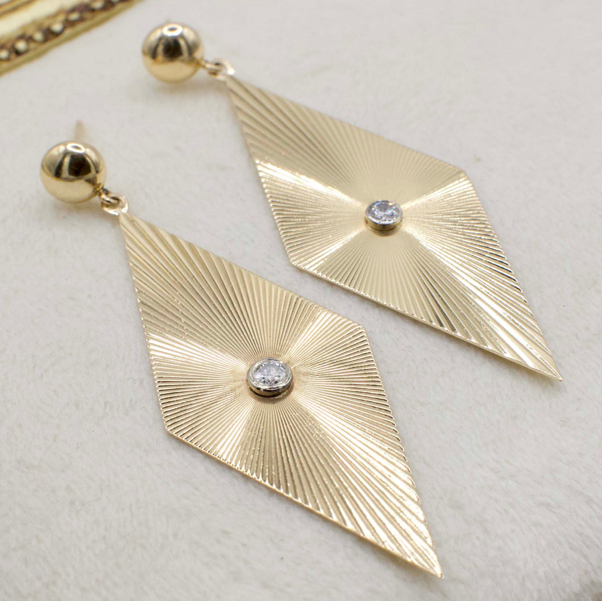 Circa 1970 14K Yellow Gold Fluted Ray Rhombus Earrings With Bezel Set Diamond Accents
