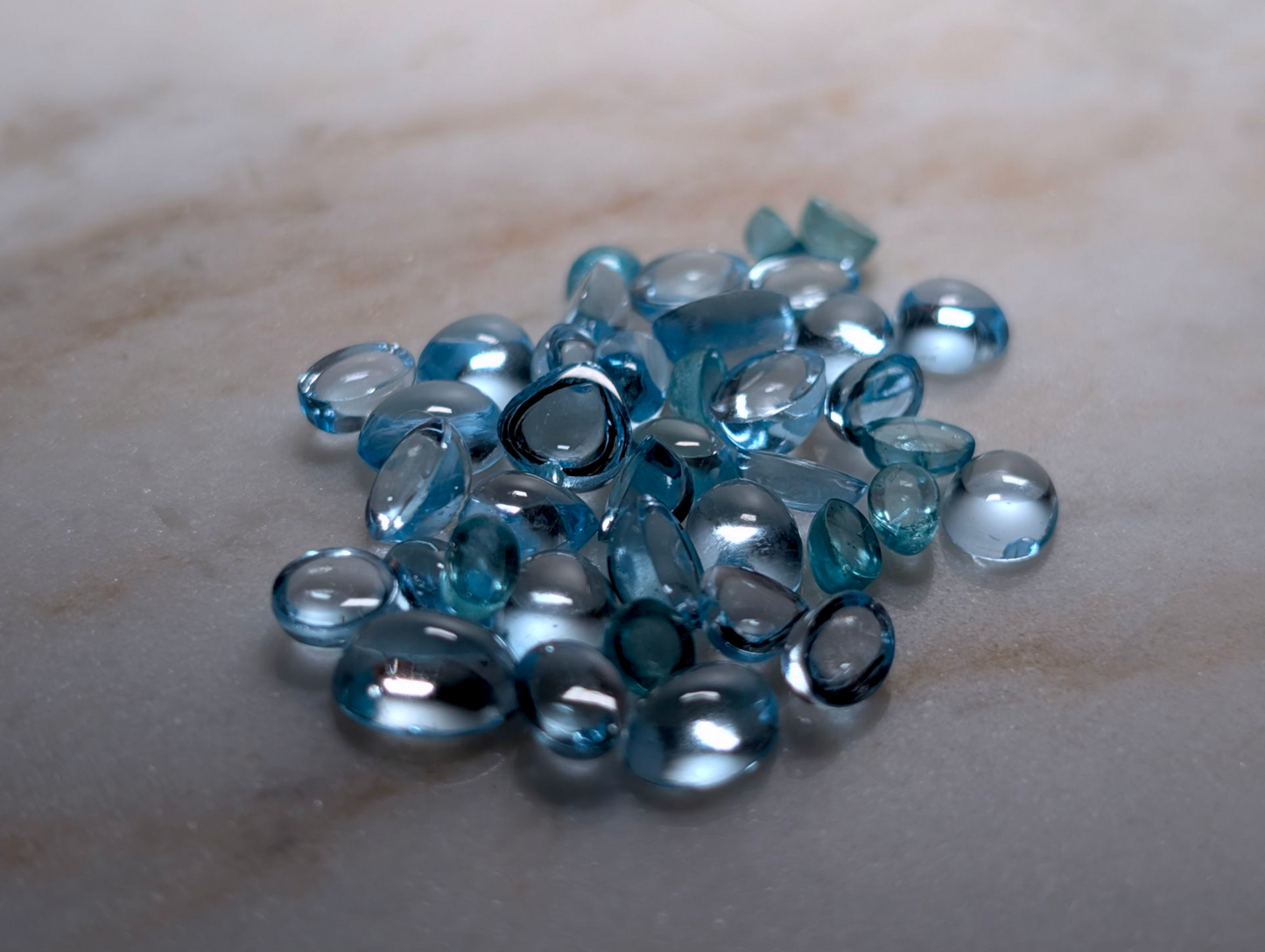 27.5 Carat Lot of Oval, Heart, and Round Cabochon Cut Genuine Swiss Blue Topaz Loose Gemstones
