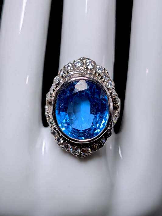Vintage Large 14 Carat Oval Cut Genuine Swiss Blue Topaz Solitaire with Simulated Diamond Accents Sterling Silver Statement Ring
