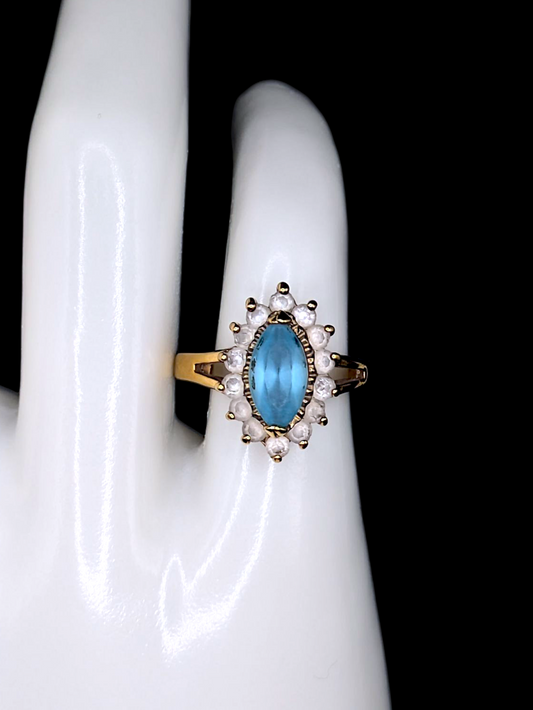 Vintage Marquise Cut Simulated Blue Topaz Solitaire with Simulated Diamond Sunburst Halo Gold Toned Ring