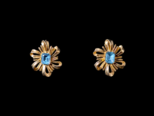 1950s-1960s Vintage Trifari Crown Ribbon Filigree Starburst Simulated Blue Aquamarine Rhinestone Gold Toned Costume Clip On Earrings