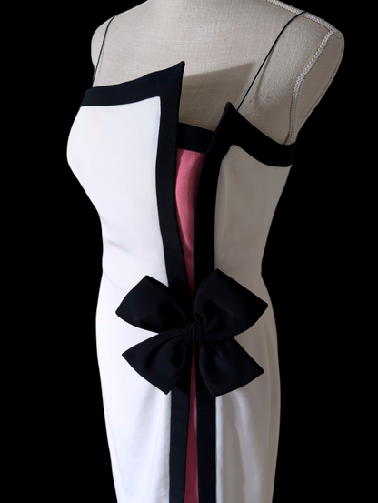 1980s Couture Designer Bill Blass White and Black Hourglass Evening Dress with Hot Pink Color Blocking, Asymmetrical Neckline, Decorative Accent Bow and Spaghetti Straps