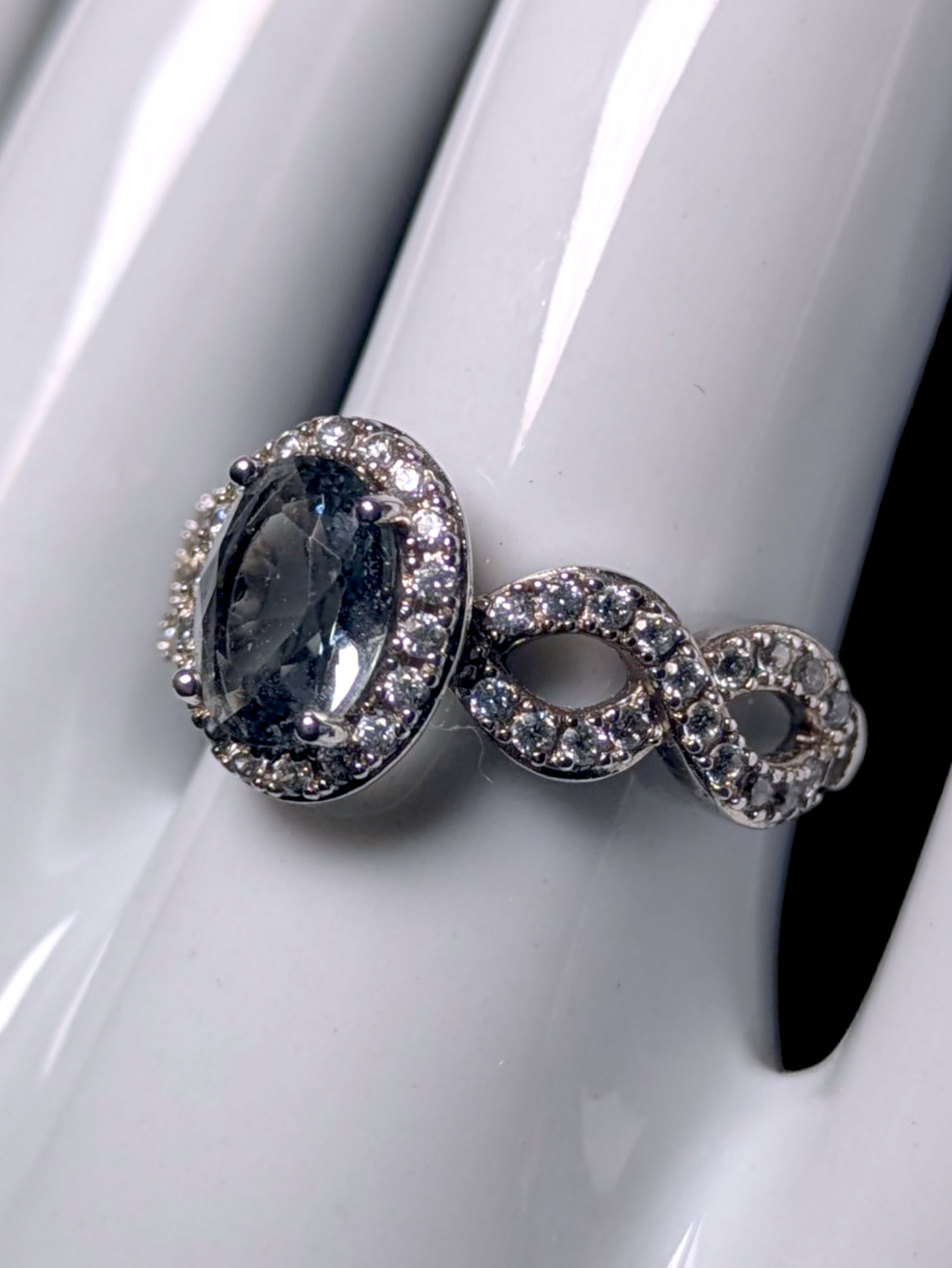 Vintage Oval Cut Simulated Smoky Blue Topaz and Simulated Diamond Halo Silver Toned Ring
