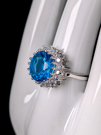 Vintage Inspired Round Cut Simulated Topaz Solitaire and Diamond Halo Sterling Silver Ring