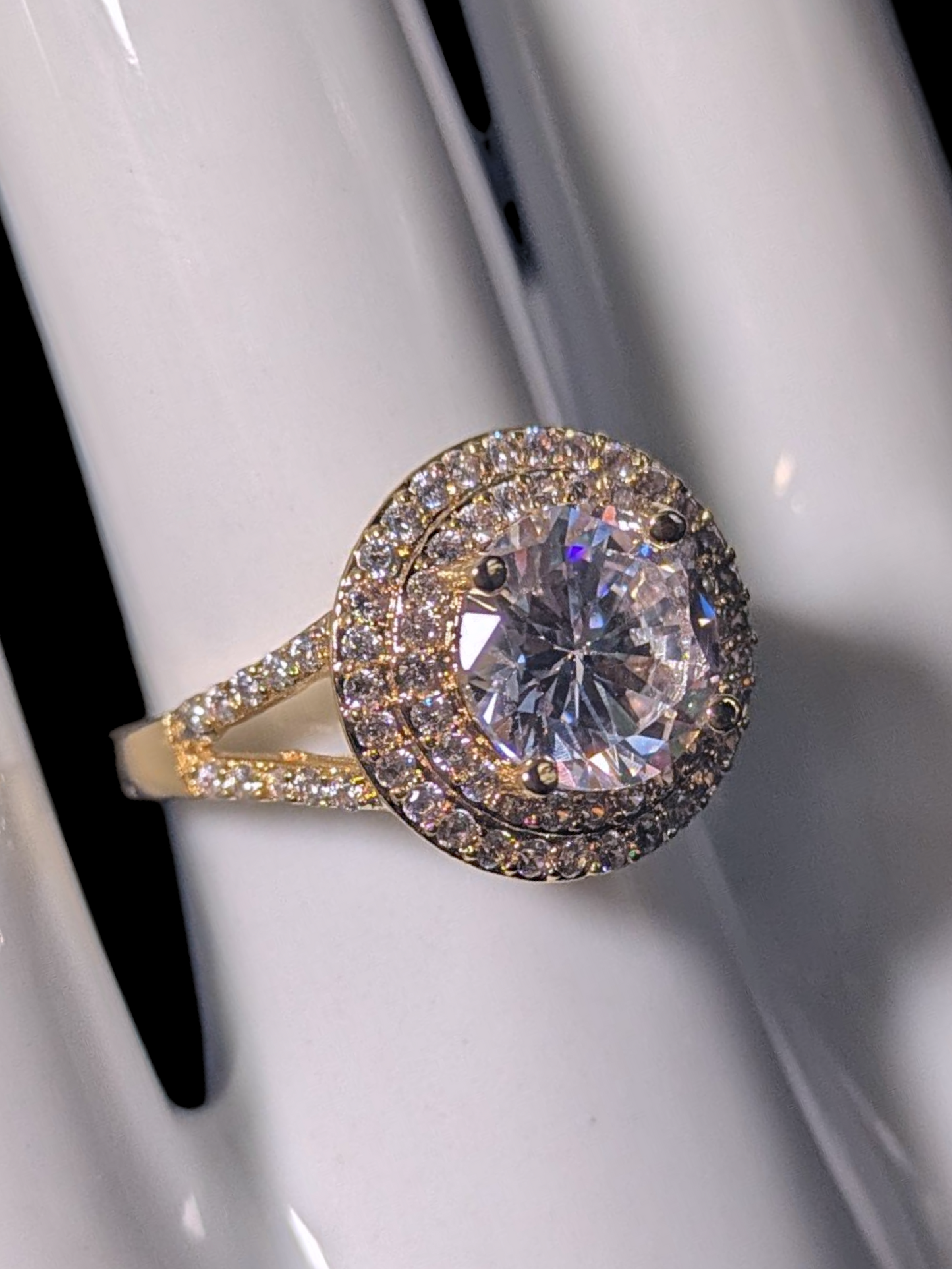 Vintage Inspired Round Cut Simulated Diamond Solitaire with Simulated Diamond Double Halo and Accented Band Gold Toned Vacation Ring