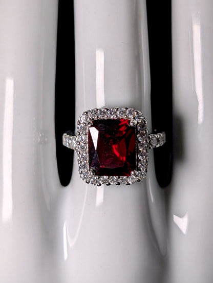 Vintage Inspired Emerald Cut Simulated Garnet Solitaire and Diamond Halo Sterling Silver Ring