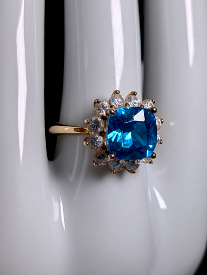 Vintage 1950s Inspired Cushion Cut Simulated Swiss Blue Topaz with Simulated Diamond Starburst Halo Gold over Sterling Cocktail Ring