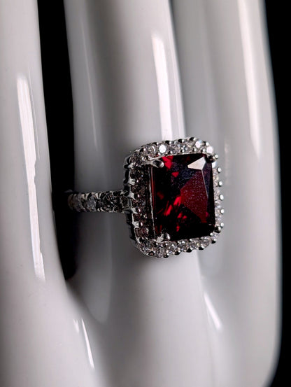 Vintage Inspired Emerald Cut Simulated Garnet Solitaire and Diamond Halo Sterling Silver Ring