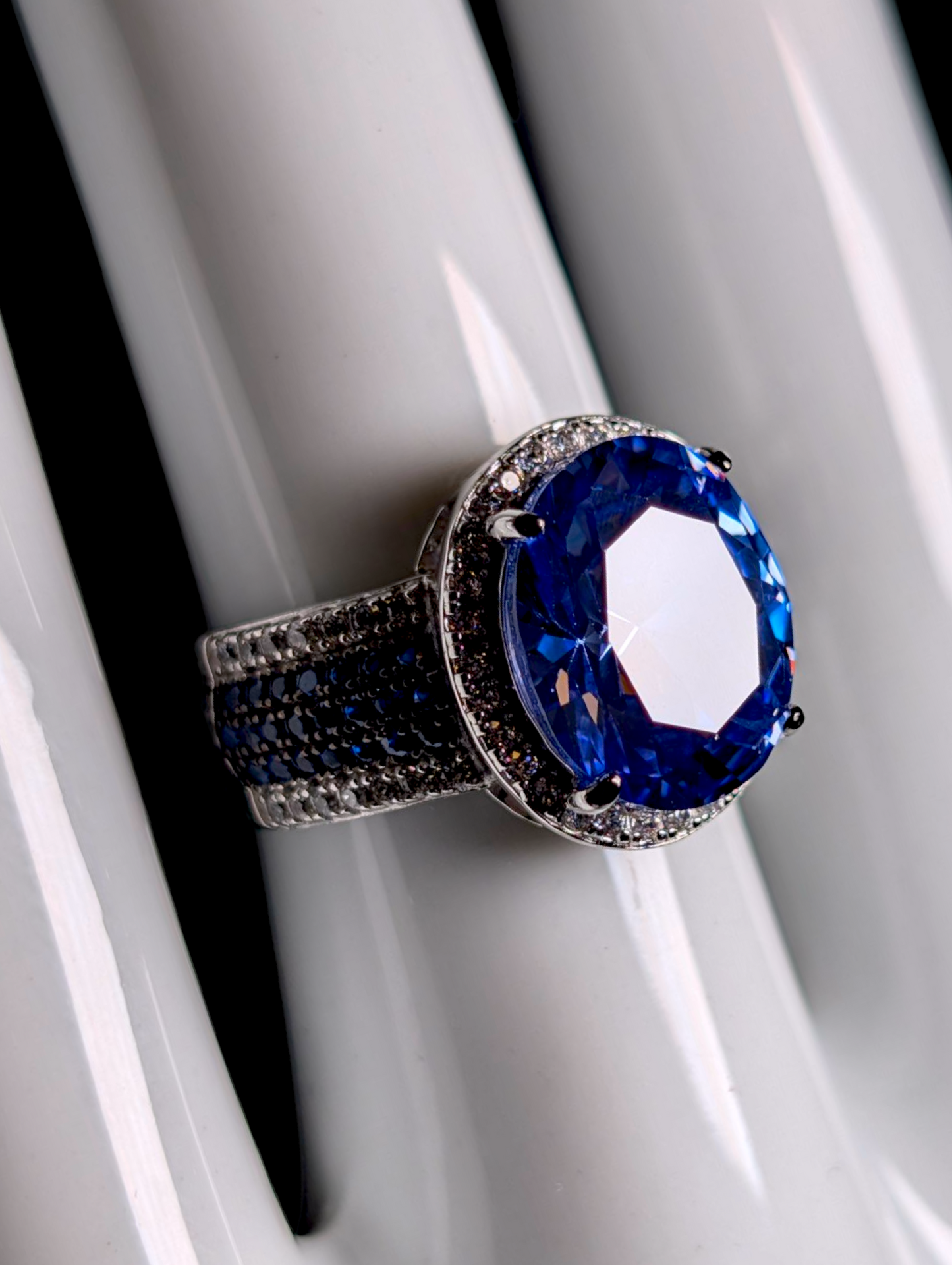 Vintage Inspired Oval Cut Simulated Sapphire with Simulated Diamond Halo Sterling Silver Ring