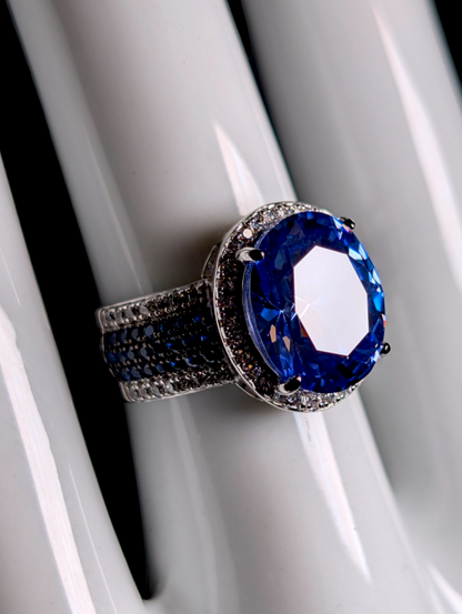 Vintage Inspired Oval Cut Simulated Sapphire with Simulated Diamond Halo Sterling Silver Ring