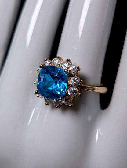 Vintage 1950s Inspired Cushion Cut Simulated Swiss Blue Topaz with Simulated Diamond Starburst Halo Gold over Sterling Cocktail Ring