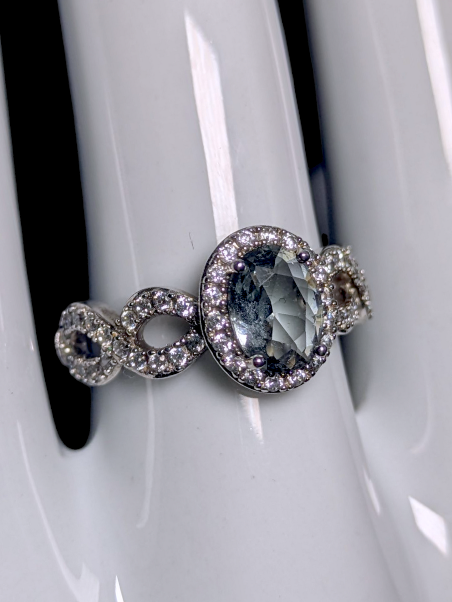 Vintage Oval Cut Simulated Smoky Blue Topaz and Simulated Diamond Halo Silver Toned Ring