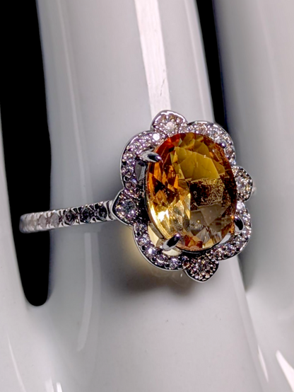 Vintage Inspired Oval Cut Simulated Citrine Solitaire with Simulated Diamond Ornate Halo Silver Toned Ring