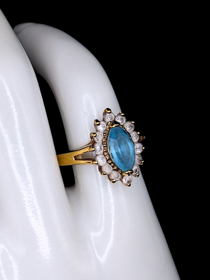 Vintage Marquise Cut Simulated Blue Topaz Solitaire with Simulated Diamond Sunburst Halo Gold Toned Ring