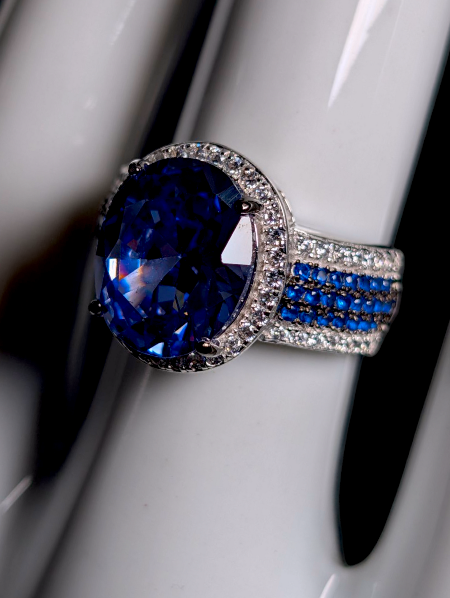 Vintage Inspired Oval Cut Simulated Sapphire with Simulated Diamond Halo Sterling Silver Ring