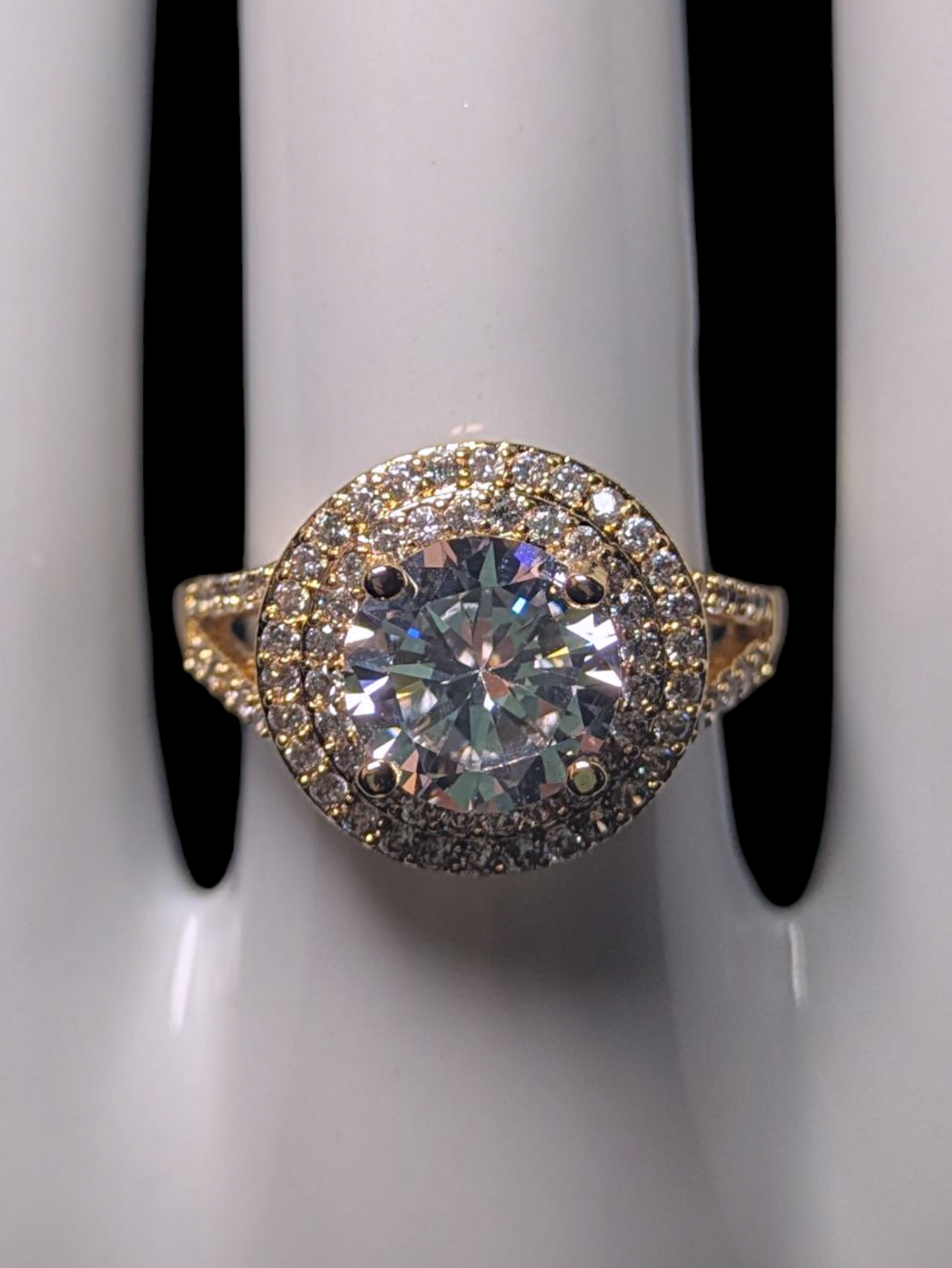 Vintage Inspired Round Cut Simulated Diamond Solitaire with Simulated Diamond Double Halo and Accented Band Gold Toned Vacation Ring