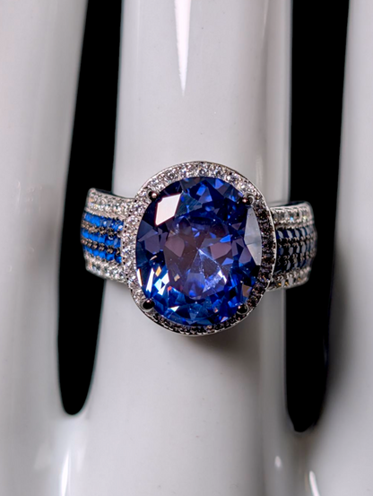 Vintage Inspired Oval Cut Simulated Sapphire with Simulated Diamond Halo Sterling Silver Ring