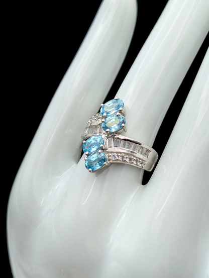 Vintage Wrap Oval Cut Genuine Swiss Blue Topaz and White Topaz Rhodium over Sterling Silver Ring
